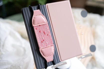 Kittentailor Original Strawberry White Chocolate Kindle strap. Features black metal clips and creamy white leather with solid pink double-layer elastic. Perfect for minimalist sweet aesthetic lovers.