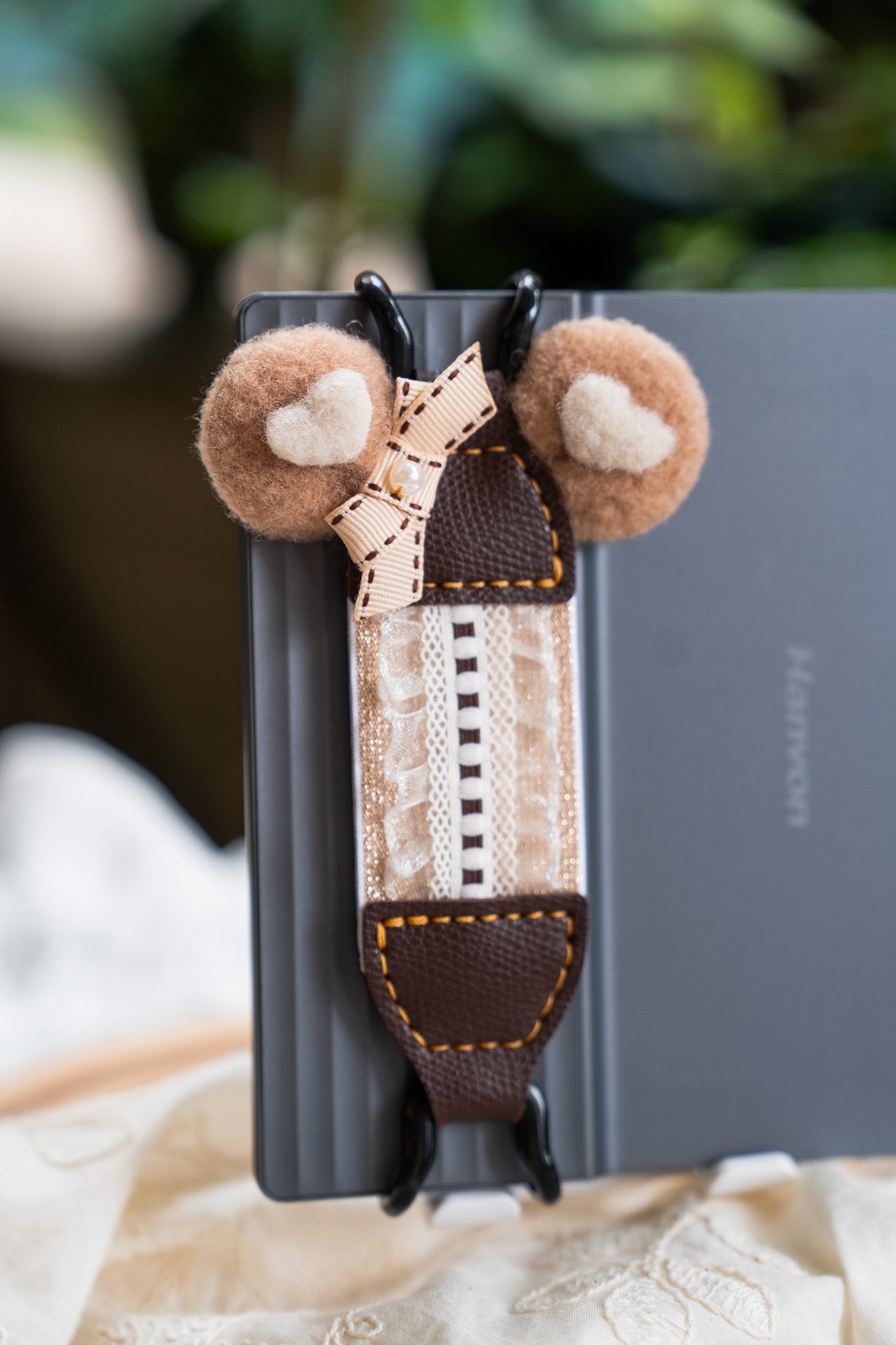 Cookie Thief Bear style with fluffy plush bear ears. Features black metal clips and dark brown vegan leather. Detailed with textured brown stripes, a bow, and pearls. A cozy winter essential and cute gift for teens, fitting Y2K and Y3K aesthetics.