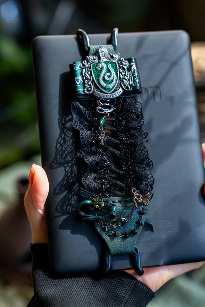 Vintage Detail: Adorned with a metallic crest and mystery charms.