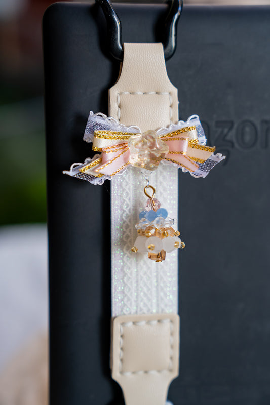 Kittentailor Original Ballerina Series Kindle strap. Handmade with shimmering textured lace, skin-friendly vegan leather, and durable metal clips. Minimalist yet colorful textured accessory with a Balletcore aesthetic.